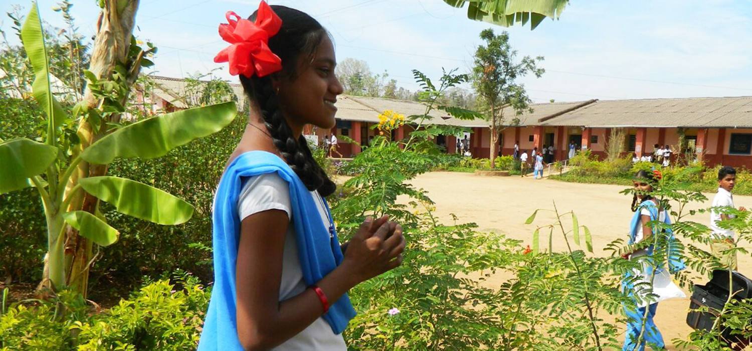 Girl in front of a school